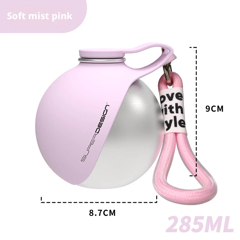Bebedero portátil para perro de acero inoxidable de 285 ml en color rose clair avec un clip de transport.
