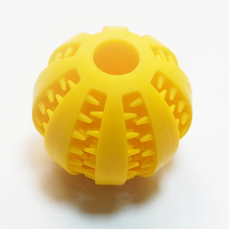 pelota dispensadora de premios para perro de caucho Mitzon jaune avec picots pour jeux et récompenses.