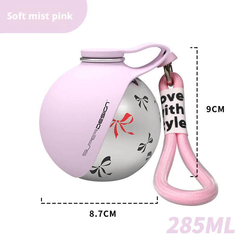 Bebedero portátil para perro de acero inoxidable 285 ml en color rose avec goupille pour un transport facile.